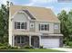 Charming two-story home featuring stone accents, a covered porch, attached garage, and lush landscaping at 4230 Skyboat Cir, Fort Mill, SC 29715