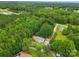Lush aerial view of property showcasing serene natural beauty, complemented by the surrounding trees and landscape at 4230 Train Chaser Pl, Indian Land, SC 29707