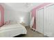 A bedroom with neutral carpet and closet at 4230 Train Chaser Pl, Indian Land, SC 29707