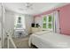 Bright bedroom with windows, a desk, and neutral carpet at 4230 Train Chaser Pl, Indian Land, SC 29707