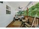 Relaxing covered porch with ample seating, string lights, and views of the private backyard at 4230 Train Chaser Pl, Indian Land, SC 29707
