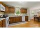 Functional kitchen with wooden cabinets, modern appliances, and a window view of the outdoors at 4230 Train Chaser Pl, Indian Land, SC 29707