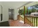 Covered porch with wooden railing at 4230 Train Chaser Pl, Indian Land, SC 29707