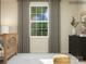 Bright Bedroom showcasing a crib, dresser, and window with soft curtains, perfect for a baby at 4262 Skyboat Cir, Fort Mill, SC 29715