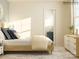 Light bedroom with modern dresser, comfy bed, neutral carpet, and large window at 4262 Skyboat Cir, Fort Mill, SC 29715