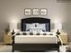 Charming bedroom with football themed art, modern bedding and bedside tables with lamps at 4262 Skyboat Cir, Fort Mill, SC 29715