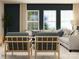 Cozy living room showcasing elegant seating, patterned rug, and natural light from large windows at 4262 Skyboat Cir, Fort Mill, SC 29715