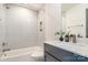 Bright bathroom featuring a shower over tub combination, vanity with sink and mirror at 428 E 33Rd St, Charlotte, NC 28205