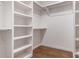 Spacious walk-in closet offers ample storage with built-in shelves and hanging rods at 428 E 33Rd St, Charlotte, NC 28205