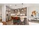 Modern kitchen featuring gray cabinets, stainless steel appliances, and a quartz countertop island at 428 E 33Rd St, Charlotte, NC 28205