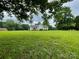 Beautiful single-story home with a large front yard and mature trees providing ample shade at 4317 Waxhaw Indian Trail Rd, Indian Trail, NC 28079