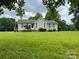 Charming single-story home with a well-maintained front yard and inviting curb appeal at 4317 Waxhaw Indian Trail Rd, Indian Trail, NC 28079
