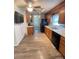 Functional kitchen with wood cabinets, laminate floors, and modern appliances at 4317 Waxhaw Indian Trail Rd, Indian Trail, NC 28079