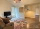 Inviting living room featuring hardwood floors, a ceiling fan, and a comfortable seating area at 4317 Waxhaw Indian Trail Rd, Indian Trail, NC 28079