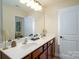 Bathroom with double sink vanity, large mirror, and ample counter space at 4323 Bright Rd, Charlotte, NC 28214