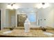 Bright bathroom with granite countertops, double sinks, a shower, and a tub at 4323 Bright Rd, Charlotte, NC 28214