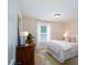 Comfortable bedroom with a cozy bed, dresser, and natural light from the window at 4323 Bright Rd, Charlotte, NC 28214