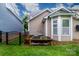 Exterior view with raised garden beds and well-maintained landscaping at 4323 Bright Rd, Charlotte, NC 28214