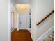 Bright foyer with hardwood floors and view to staircase at 4323 Bright Rd, Charlotte, NC 28214