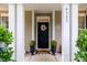 Inviting front entrance with decorative wreath and well-manicured plants at 4323 Bright Rd, Charlotte, NC 28214