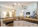 The kitchen offers granite counters, stainless steel appliances, and a view into the living room at 4323 Bright Rd, Charlotte, NC 28214