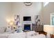 Bright living room boasts a fireplace, high ceilings, and stylish decor with a large comfortable sofa at 4323 Bright Rd, Charlotte, NC 28214