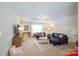 Spacious living room with plush seating, large windows, and neutral decor at 4323 Bright Rd, Charlotte, NC 28214
