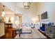 Spacious living room with high ceilings, a fireplace, and comfortable seating at 4323 Bright Rd, Charlotte, NC 28214