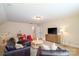 Open living area with cozy furniture, television, and playroom area at 4323 Bright Rd, Charlotte, NC 28214