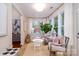 Cozy sunroom area with plush seating, bright windows, and charming decor at 4323 Bright Rd, Charlotte, NC 28214