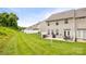 A large backyard with a patio, seating, and green grass at 444 Battery Cir, Clover, SC 29710