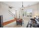 Inviting living room with a comfortable leather sofa, lots of natural light, and a staircase at 444 Battery Cir, Clover, SC 29710
