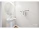 Clean powder room featuring a pedestal sink and modern fixtures at 444 Battery Cir, Clover, SC 29710