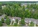 Aerial view of townhomes surrounded by lush trees at 4557 Panther Pl, Charlotte, NC 28269
