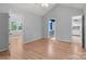 Bedroom with light gray walls, wood floors, and a ceiling fan at 4557 Panther Pl, Charlotte, NC 28269