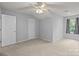 Bedroom featuring neutral walls, carpet flooring, ceiling fan, and a window at 4557 Panther Pl, Charlotte, NC 28269