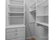 Walk-in closet featuring white built-in shelving and drawers at 4557 Panther Pl, Charlotte, NC 28269