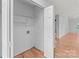 Open closet with wood floors, wire shelving, and in-wall plumbing hookups at 4557 Panther Pl, Charlotte, NC 28269