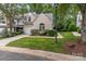 Inviting exterior showcasing lush landscaping, a well-maintained lawn, and a cozy street view at 4557 Panther Pl, Charlotte, NC 28269