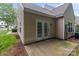Home featuring an outdoor patio and neutral siding at 4557 Panther Pl, Charlotte, NC 28269