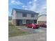 Two-story condominium with vinyl siding, brick facade, and a paved parking area at 484 Willow Spring Ln # A, Rock Hill, SC 29730