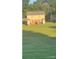 A spacious backyard featuring green grass, a patio set, and an exterior unit at 484 Willow Spring Ln # B, Rock Hill, SC 29730