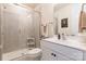 Modern bathroom featuring a glass shower, white vanity, and neutral tile flooring at 5130 Watersail Way, Clover, SC 29710