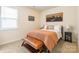 Cozy bedroom with bed, side table, accent pieces, and natural light from the window at 5130 Watersail Way, Clover, SC 29710