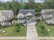Charming two-story home featuring lush landscaping, well-maintained lawn, and a paved driveway leading to the garage at 5130 Watersail Way, Clover, SC 29710