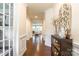 Elegant foyer featuring hardwood floors, decorative molding, and a view into the spacious living area at 5130 Watersail Way, Clover, SC 29710