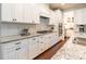 Bright kitchen with white cabinetry, granite countertops, stainless steel appliances, and subway tile backsplash at 5130 Watersail Way, Clover, SC 29710