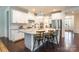 Modern kitchen featuring granite island with bar stools, stainless appliances, and ample cabinet space at 5130 Watersail Way, Clover, SC 29710