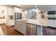 Bright kitchen with stainless steel appliances, island with sink, and open layout at 5130 Watersail Way, Clover, SC 29710