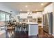 Open kitchen with granite countertops, stainless steel appliances, and breakfast bar seating at 5130 Watersail Way, Clover, SC 29710